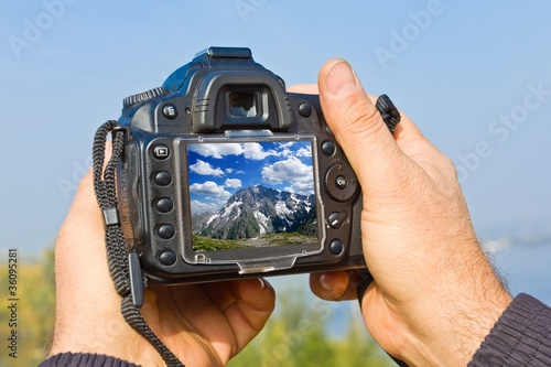 digital photo camera in a people hands