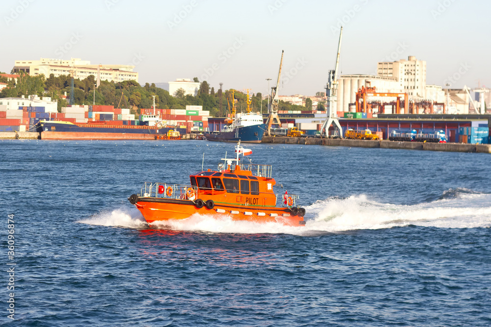 Tug boat in front of sea port