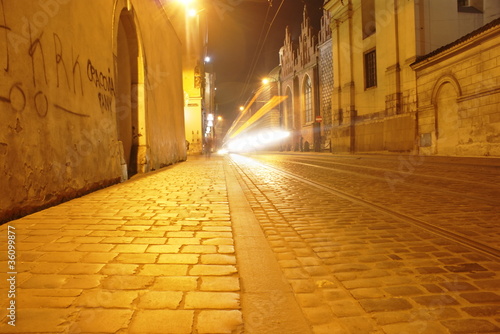 Old brick street with tram tracks in Krakow,Poland