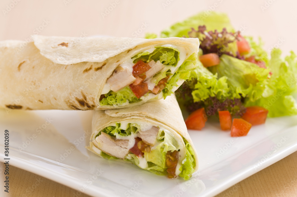 Two avocado wrap with a healthy side salad Two avocado wrap with a healthy side salad