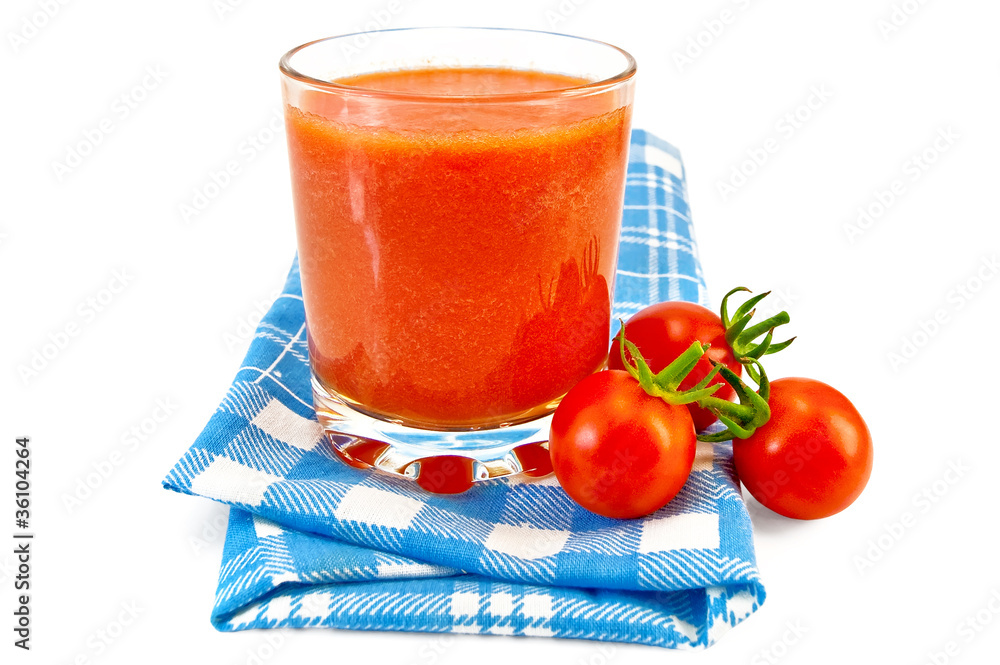 Juice tomato in glass on a napkin Juice tomato in glass on a napkin