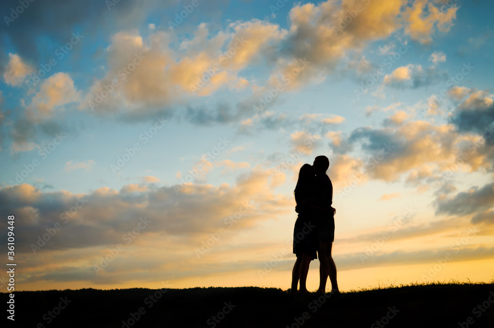 Young couple  at sunset