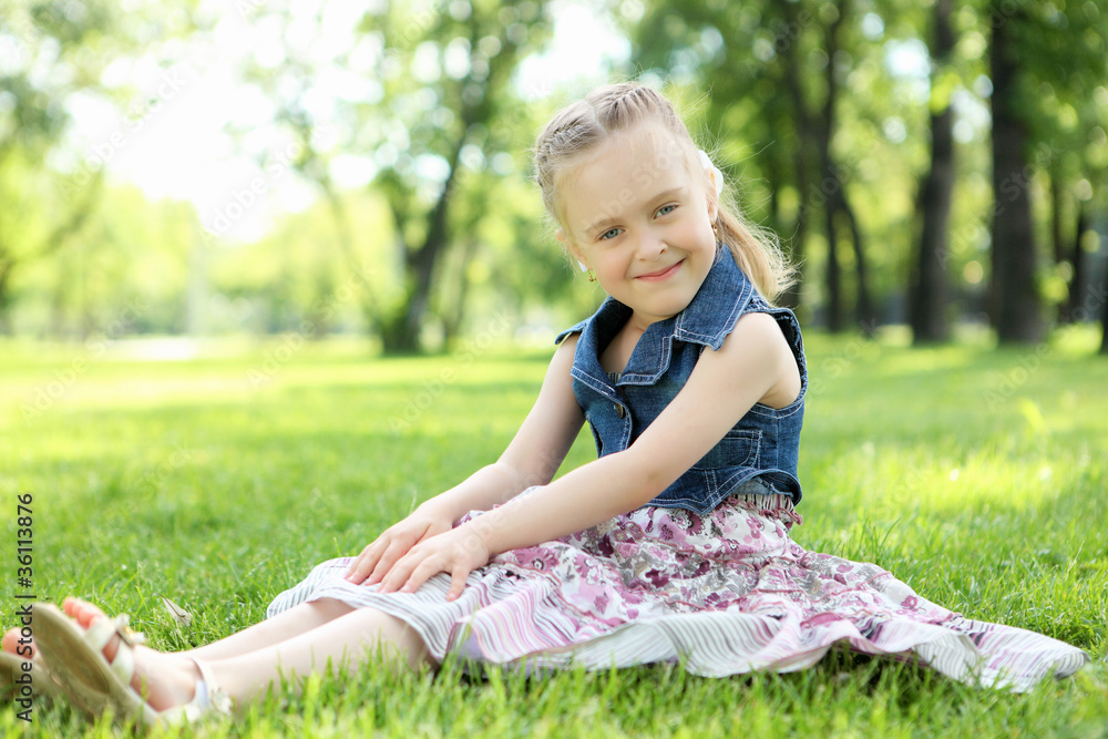 Portrait of a little girl in the park Portrait of a little girl in the park