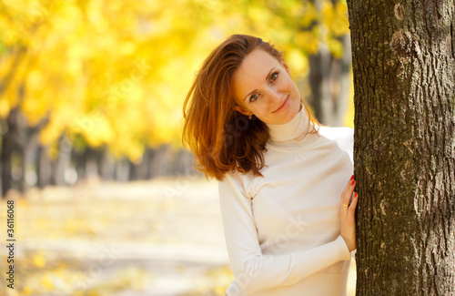 Young woman in autumn park