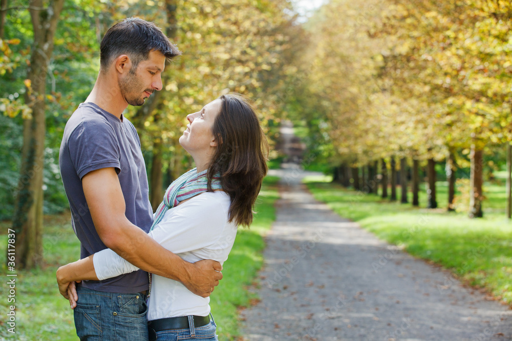 Young Couple Walking in autumn park Young Couple Walking in autumn park