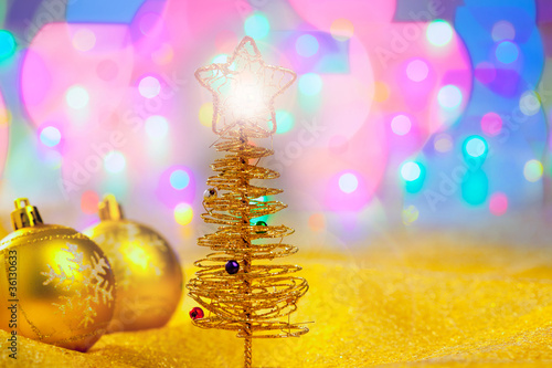 Christmas golden tree with baubles and lights