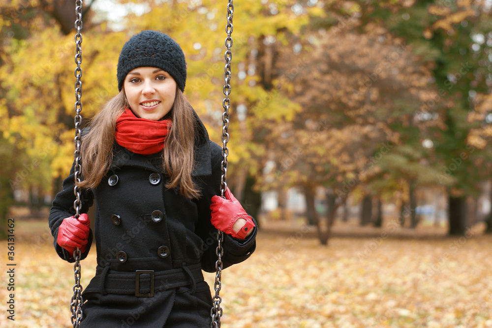 Young attractive girl in autumn park