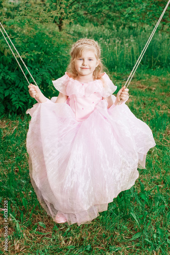 happy little girl on swing