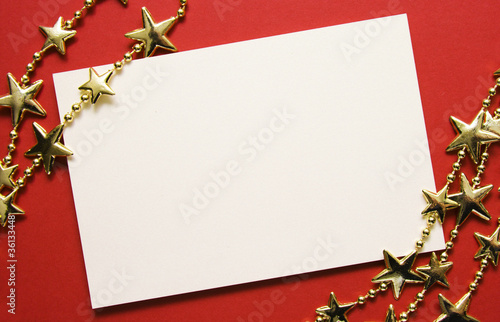 Greeting cards and gold stars on red paper