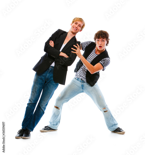 Two teenage boys having fun. Isolated on white