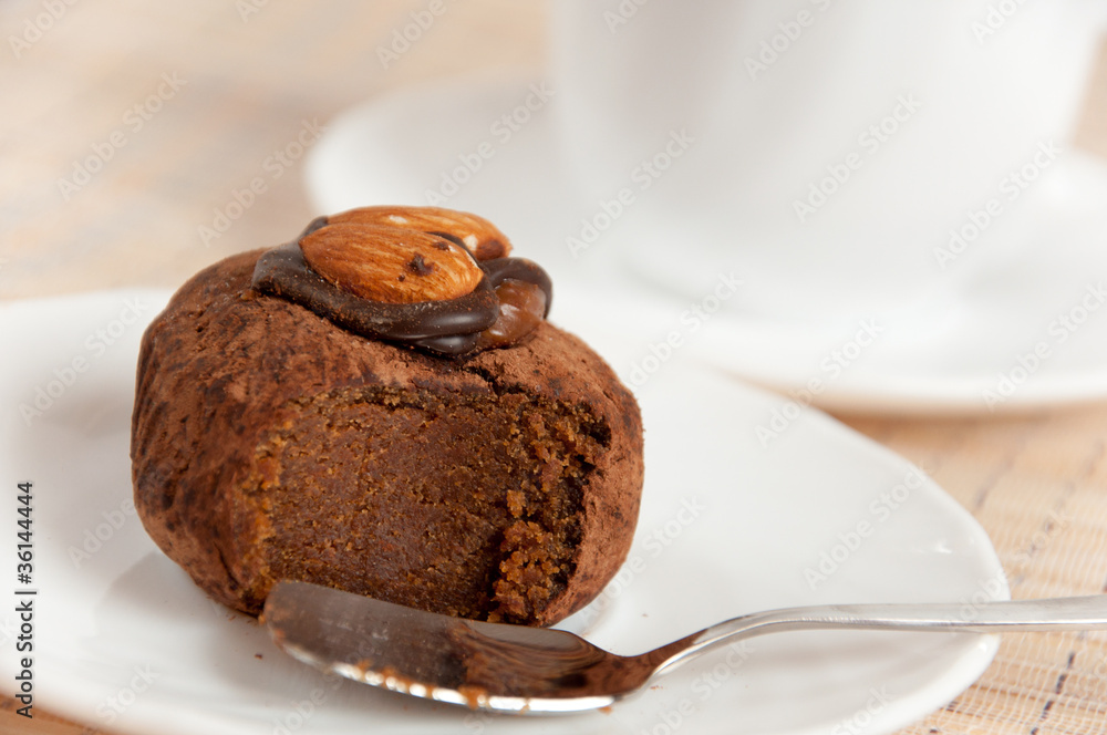 A delicious dessert - almond truffles and coffee A delicious dessert - almond truffles and coffee