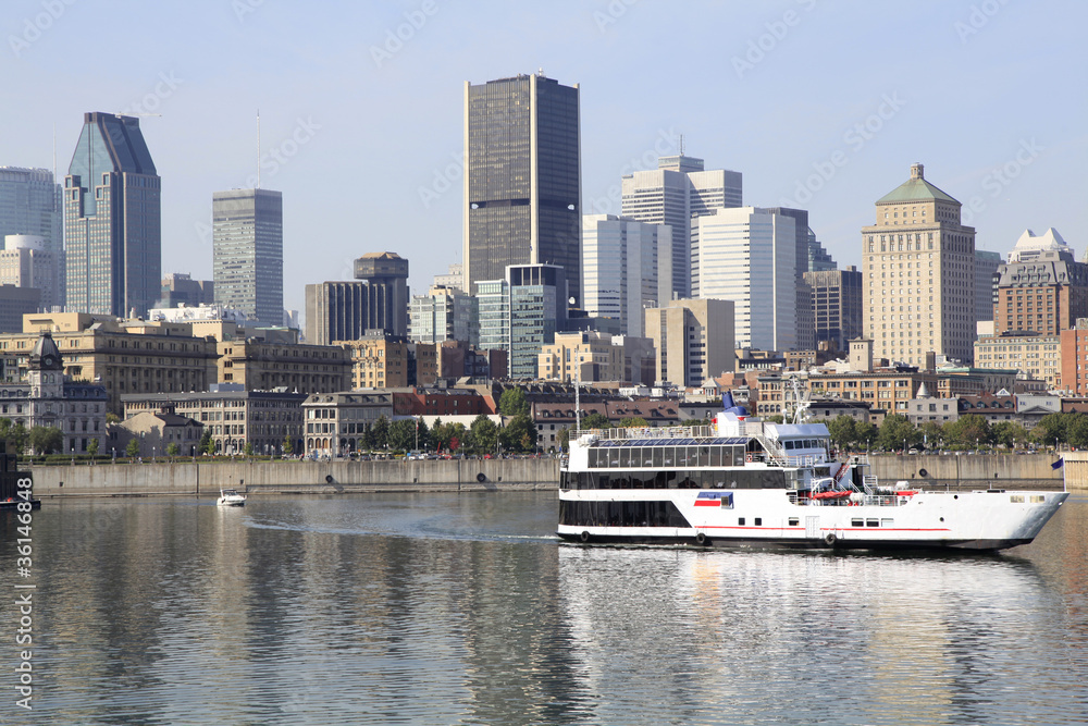 Motreal skyline and cruise boat on Saint Lawrence River
