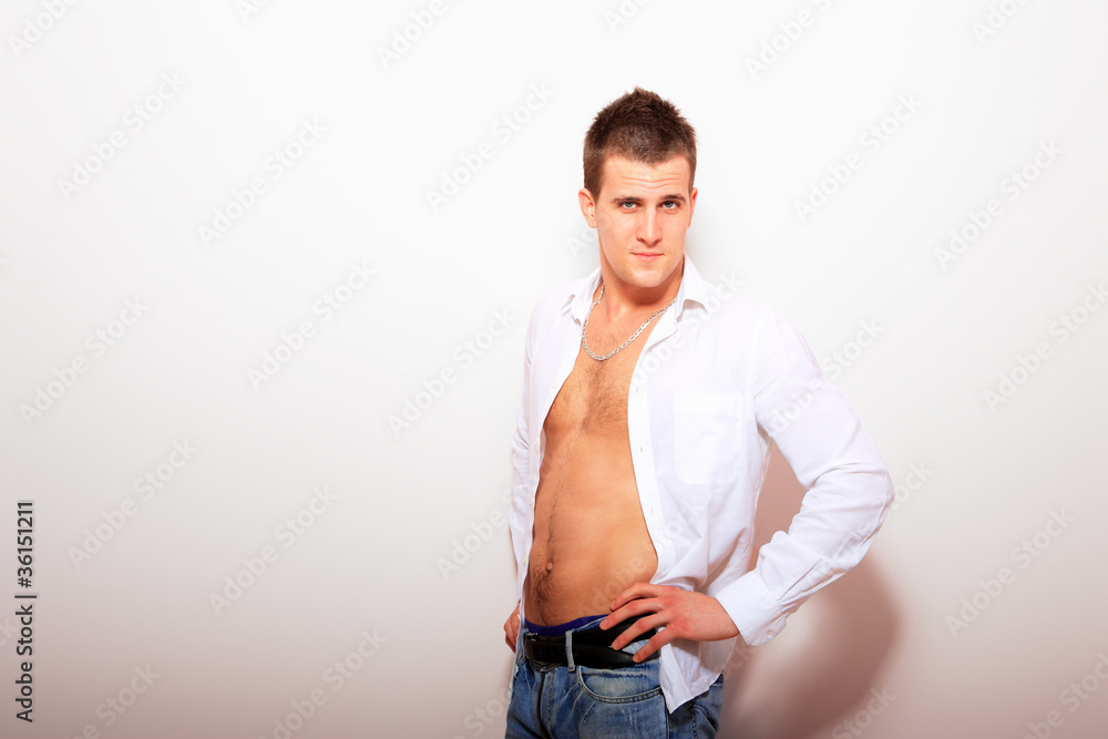Handsome man casually against the wall Handsome man casually against the wall