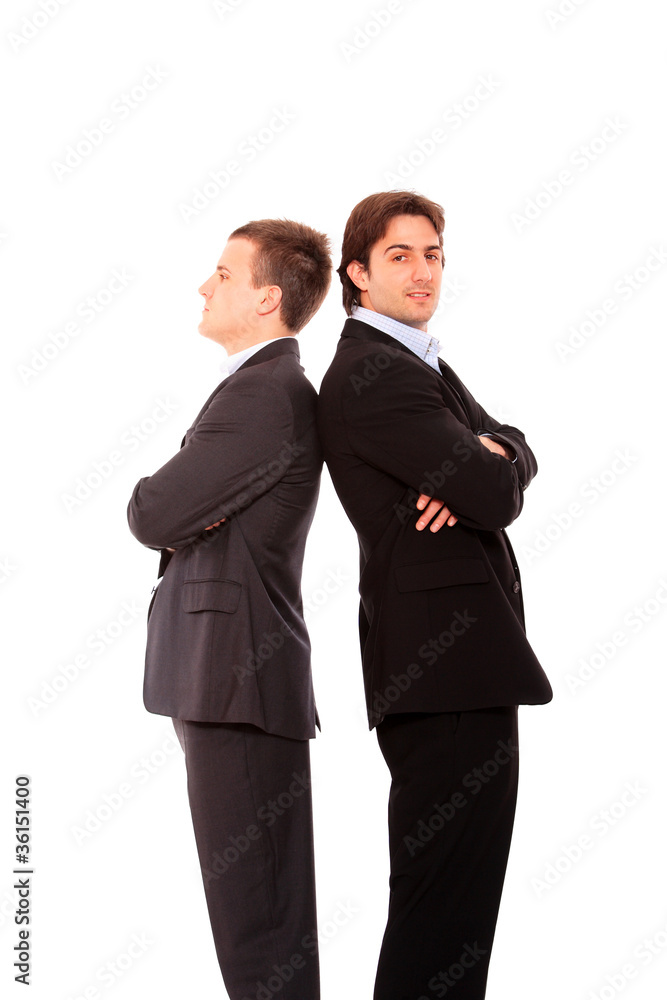 Two business men standing back to back Two business men standing back to back