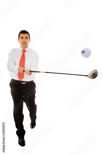Young business man swinging a golf club isolated over white back