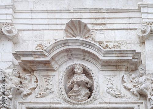 Baroque tympanum in Monopoli, Italy