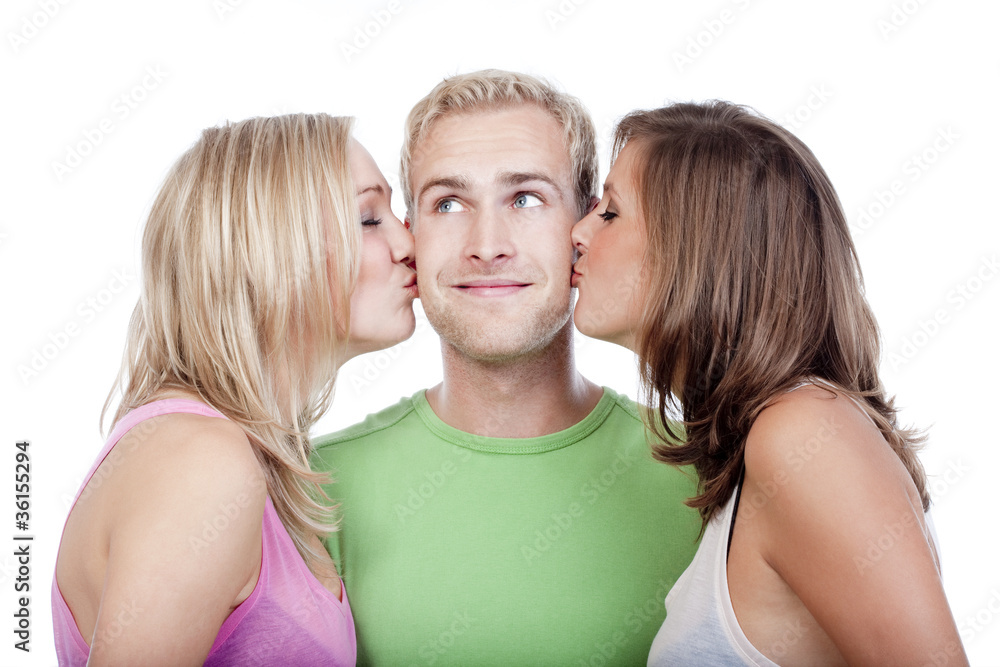 man being kissed by two girls man being kissed by two girls
