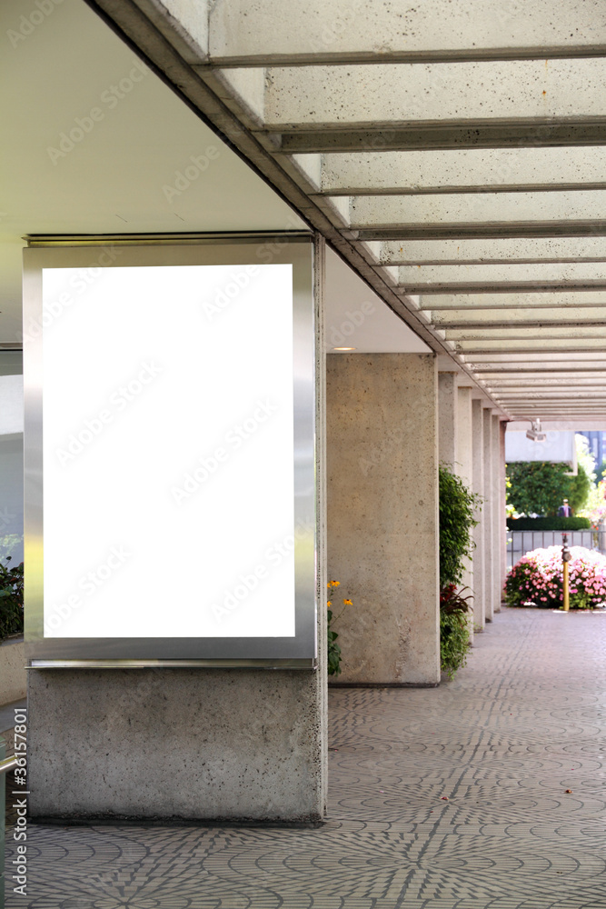 Blank billboard in a shopping mall passage