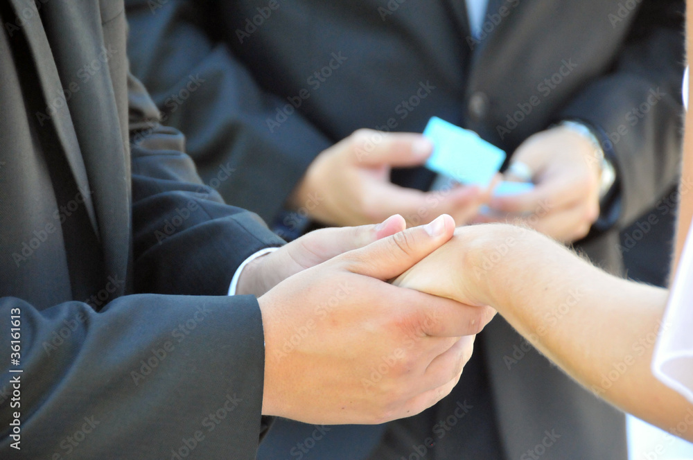 Bride and groom close-up holding hands Bride and groom close-up holding hands
