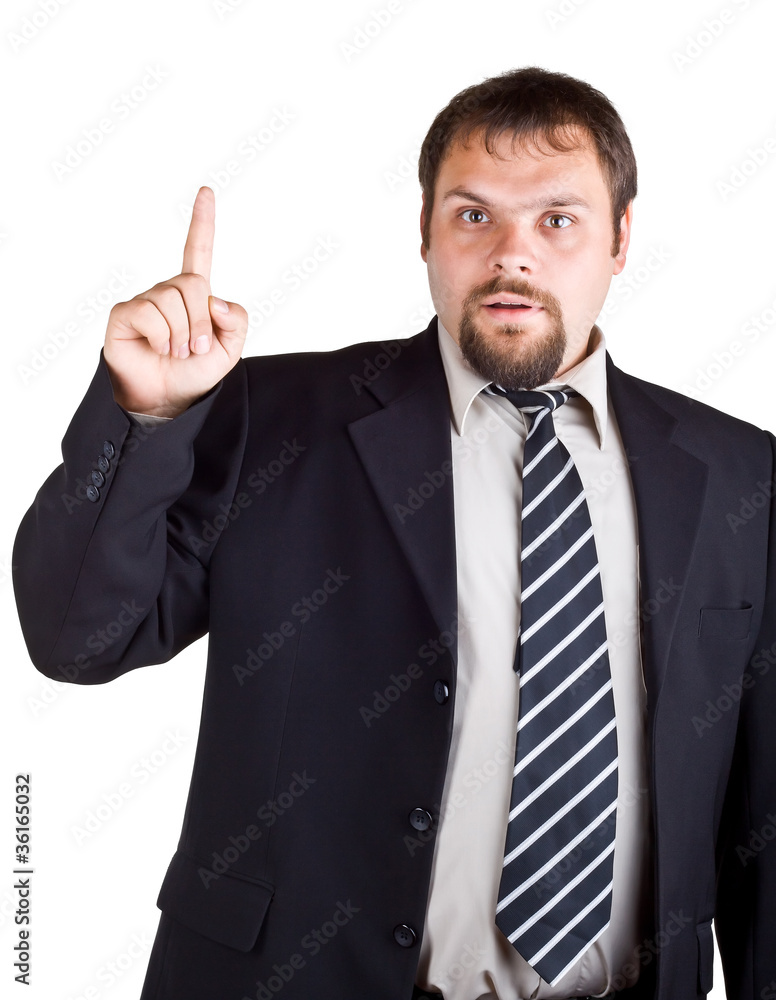 Businessman in a suit with a raised index finger Businessman in a suit with a raised index finger