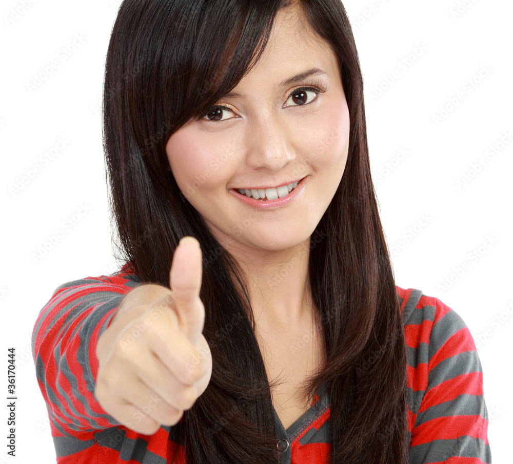 girl showing thumbs up and smiling girl showing thumbs up and smiling