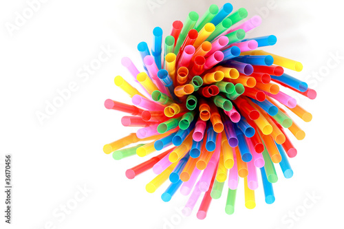 colorful drinking straws on a white background