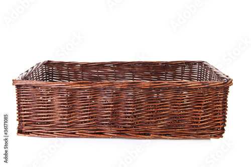Big empty cane basket over white background