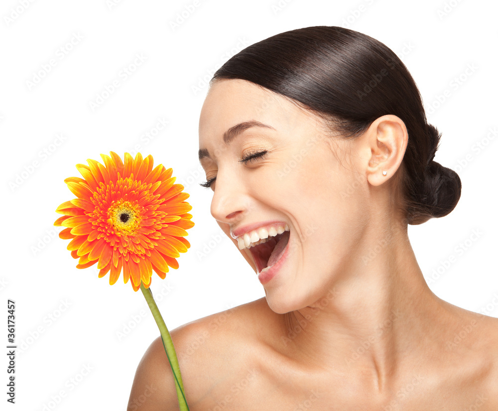 Portrait of beautiful smiling  woman with a flower.