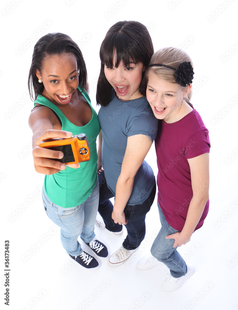Obraz premium Happy mixed race girl friends fun taking pictures