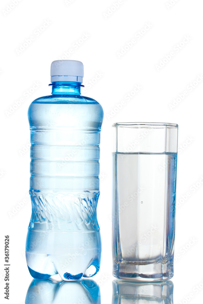 One plastic bottle and glass of water isolated on white One plastic bottle and glass of water isolated on white