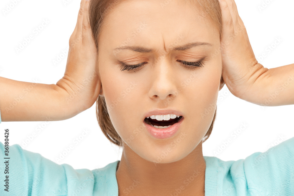 woman with hands on ears woman with hands on ears