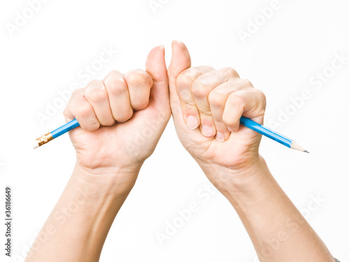 hand with broken pencil