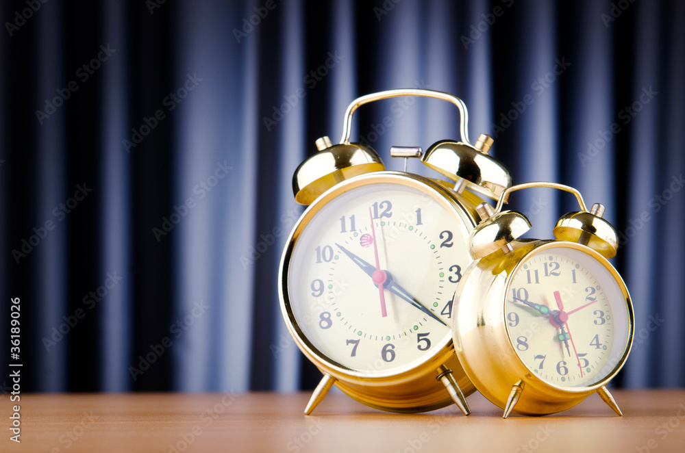 Alarm clock against curtain Alarm clock against curtain