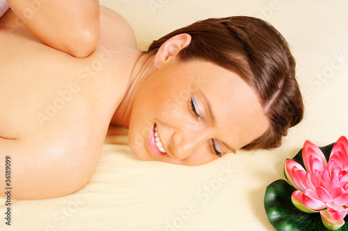 Woman getting relaxing  in beauty massage salon