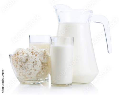 Cup serving of Cottage Cheese, two glasses and Jug of fresh milk