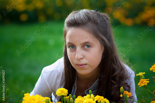 teen in field of flowers
