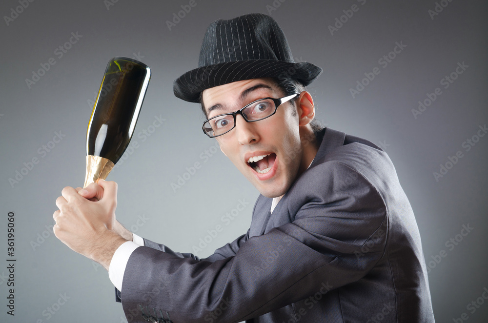 Naklejka premium Businessman with bottle of champagne