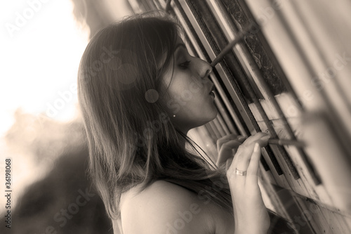 Fényképezés curious woman looking through a window
