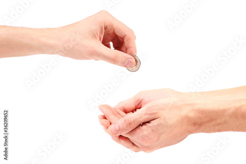 hand gives coin to beggar