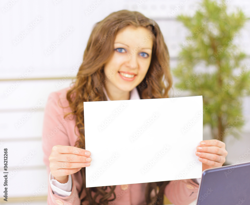 Attractive businesswoman holding a blanket card Attractive businesswoman holding a blanket card