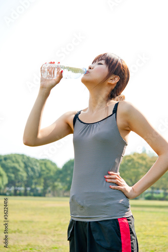 beautiful asian woman drinking pure water