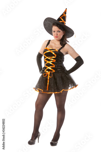 sexy girl in Halloween witch costume photo