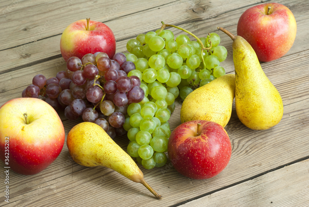 apples grapes and pears, wooden table apples grapes and pears, wooden table
