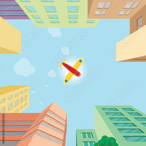 Airplane flying over the city