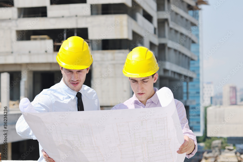 Team of architects on construciton site Team of architects on construciton site