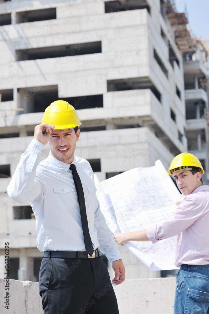 Team of architects on construciton site Team of architects on construciton site
