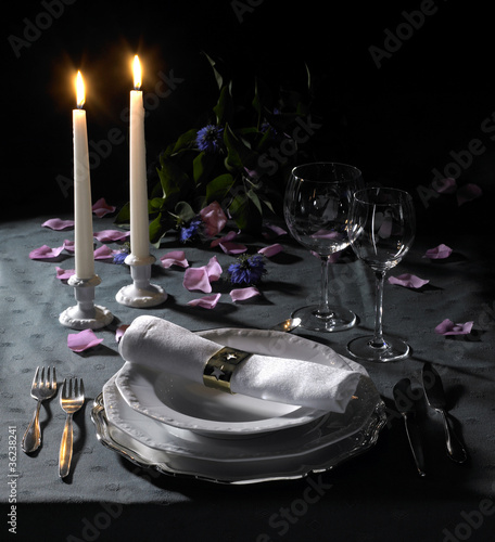 festive place setting and candlelight photo