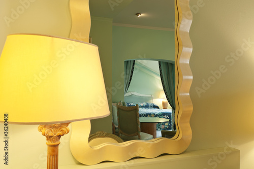 interior luxury apartment, comfortable room, mirror and lamp