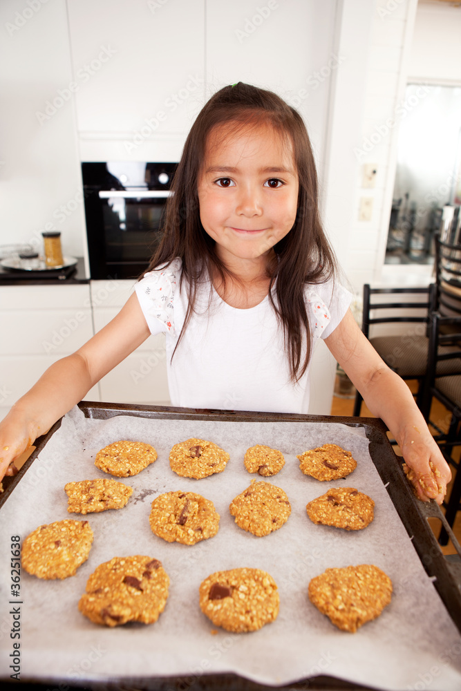 Cute Young Girl Baking Cookies