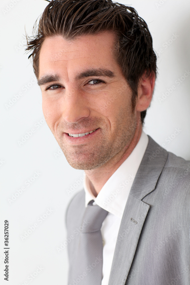 Portrait of businessman on grey background Portrait of businessman on grey background